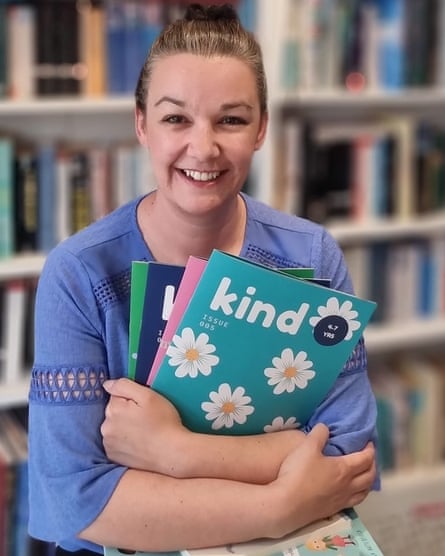 Amie Jones holding books for her kids club business