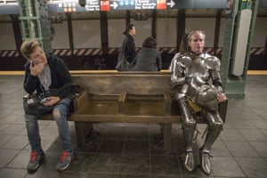 Metalsmith James Gillaspie wears a suit of medieval armour he made himself whilst waiting for the subway at the Times Square station
