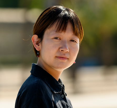 Side profile of Celine Song, with her face turned towards the camera