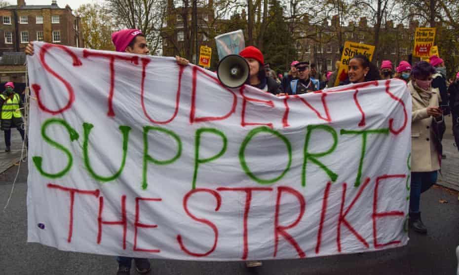 Protesters hold a banner that reads Students Support the Strike during a demonstration in Bloomsbury in December 2021.