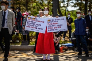 An activist calls for improved relations between Japan and South Korea outside the national assembly before the inauguration ceremony of the new president, Yoon Suk-yeol in Seoul