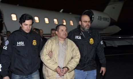Authorities escort El Chapo from a plane to a waiting SUV at Long Island MacArthur Airport in Ronkonkoma, New York on 19 January 2017.