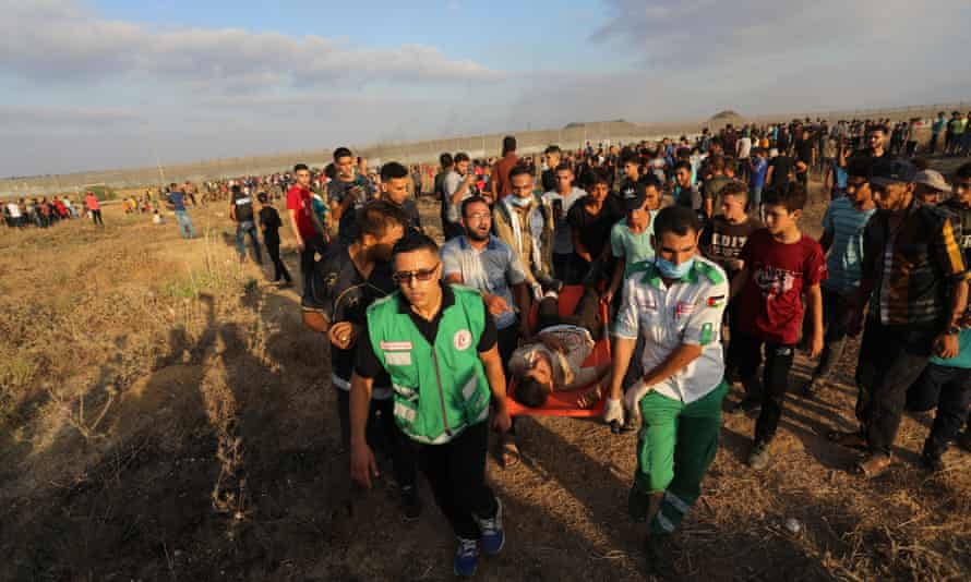 Injured youth on stretcher