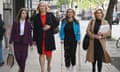 Annita McVeigh, Martine Croxall, Karin Giannone and Kasia Madera walking down a pavement looking at the camera
