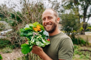 Rob Greenfield with greens grown in his garden.