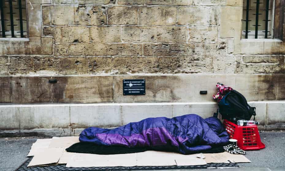 A homeless person sleeps on the street in Oxford