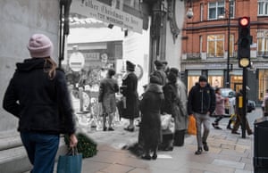Sandbags protect a Selfridges shop window in the run-up to the first Christmas of the second world war, on 16 December 1939. People stroll by the department store’s festive window display on 24 November 2017
