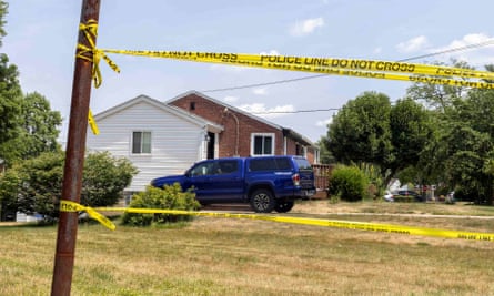 View of home with truck on drive and yellow police tape