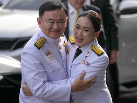 Thaksin Shinawatra, left, hugs his daughter Paetongtarn before her appointment as Thailand’s new prime minister in August 2024.