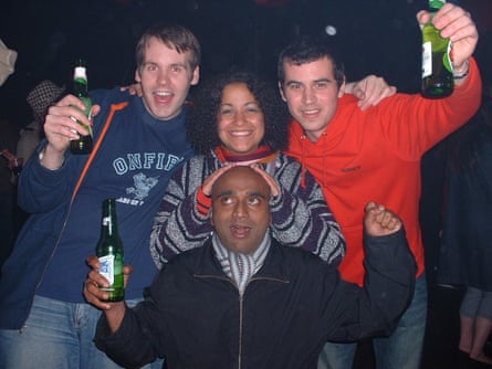 Mike Macpherson (left) and three friends pose for a picture holding bottles of lager