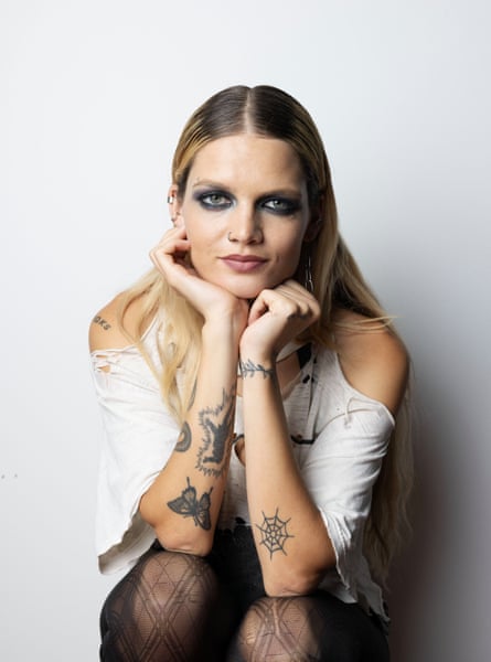 Singer-songwriter May-a sits with her hands under her chin