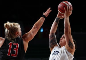 Kathleen Dandeneau of Canada in action with Judith Hamer of Britain