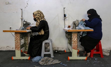 Two veiled women sewing