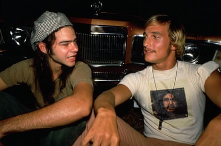 With Rory Cochrane in Dazed and Confused, 1993. The pair are sitting in front of a car