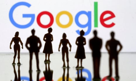Small toy figures are seen in front of the Google logo