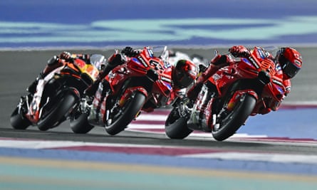 Marc Márquez leads Francesco Bagnaia and Maverick Viñales at the Lusail International Circuit in Qatar.