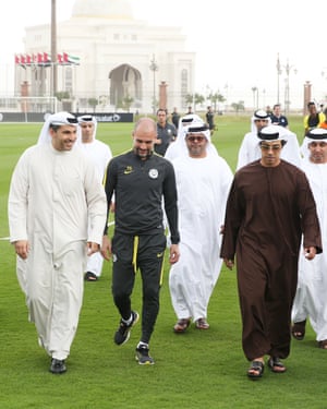 Sheikh Mansour (front right) with chairman of Manchester City FC Khaldoon al-Mubarak (front left) and Manchester City manager Pep Guardiola (front centre) at a training camp in Abu Dhabi, 2017.