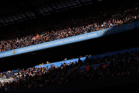 Crowded Manchester City stadium stands under a banner thanking Sheikh Mansour for ten great years