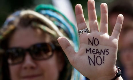 A protester shows writing on her that reads ‘No means no!’ at a protests against sexual violence in London.