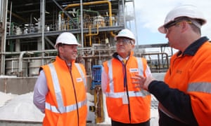 Josh Frydenberg and Malcolm Turnbull speak to a worker during a tour of the Ixom plant in Laverton North, Melbourne.