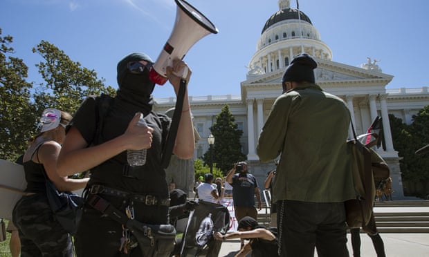 Anti-fascist activists stage a counter-protest against the Traditionalist Worker’s party and the Golden State Skinheads at the State Capitol in Sacramento.