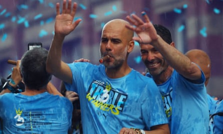 Pep Guardiola smokes a cigar