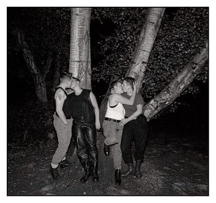 Queer Dyke Cruising, Hampstead Heath 1992 featuring two couples kissing by a tree at night.