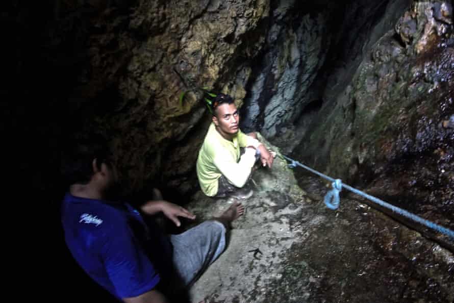 Two men in sacred underground caves