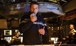 Macron speaks to the crew onboard the submarine Le Terrible on 4 July.