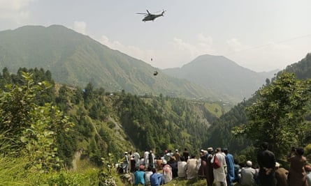 Three children being rescued earlier