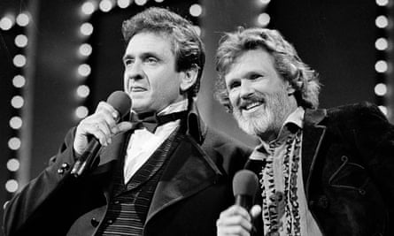 Kris Kristofferson and Johnny Cash, left, performing at the Country Music awards in Nashville, 1983.