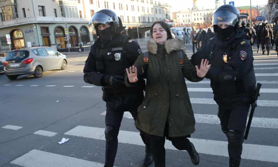 A woman is detained in Moscow after a protest against the war, 6 March 2022.