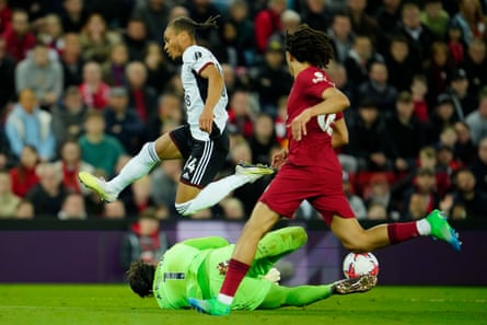 Liverpool’s goalkeeper Alisson saves on an attempt to score by Fulham’s Manor Solomon during the English Premier League soccer match between Liverpool and Fulham, at Anfield.