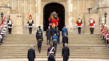 The Queen’s coffin is carried up the steps to St George’s chapel.