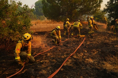 Firefighters battle a wildfire in San Martin de Valdeiglesias, west of Madrid on 26 July 2026.