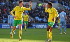 Kieran Dowell goes to high-five Sam McCallum after scoring Norwich’s fourth goal at Coventry