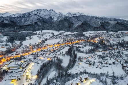 snowy and winter landscape of town and mountains