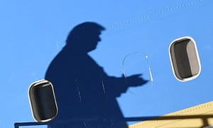 The shadow of Donald Trump falls across Air Force One as he arrived at a campaign rally yesterday.