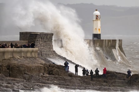 Waves crash against the harbour wall on Sunday in Porthcawl, Wales.