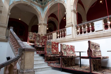 Battersea Arts Centre, staircase seats and tables, covered with carpet, press image from Haworth Tompkins, architects
