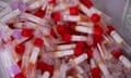 A bucket of Covid-19 test vials at a testing clinic
