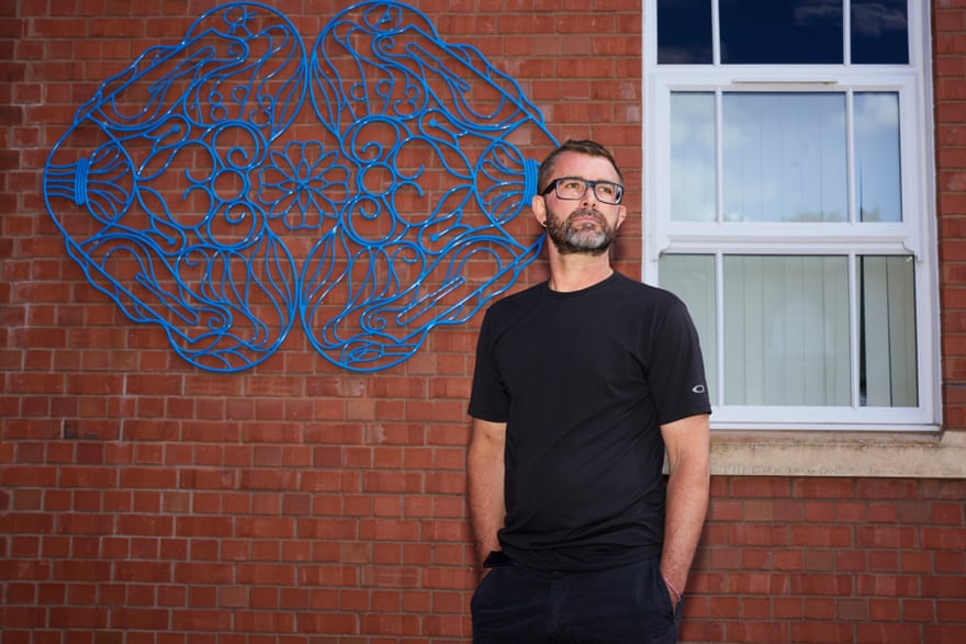 Spencer Jenkins with his newest public work, Balteum Fibula, at Manor hospital, Nuneaton.