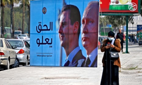 A poster of Syria’s President Bashar al-Assad and the Russian leader, Vladimir Putin, on a road in the Syrian capital, Damascus, this month. 