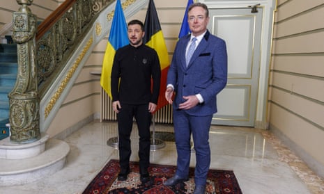 Ukraine's president Volodymyr Zelenskyy (L) poses for the photographers next to Belgium prime minister Bart De Wever prior to their bilateral meeting on the sidelines of the Special European Council.