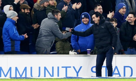 Unai Emery shakes hands with a Brighton supporter after kicking a bottle in frustration in his direction during Arsenal’s 1-1 draw at the Amex Stadium on Boxing Day
