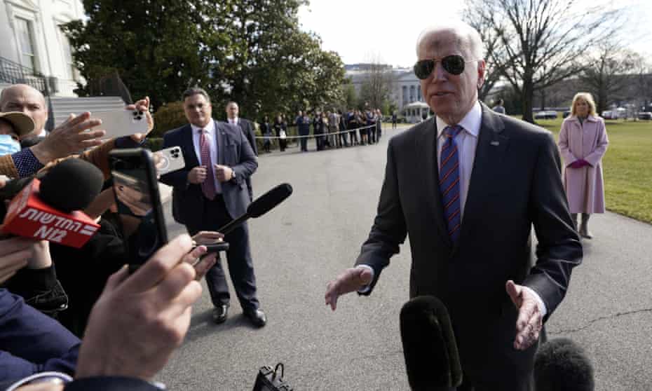 Joe Biden speaks to reporters at the White House on his way to the midwest. The uneasy balancing act between domestic and foreign priorities was reflected in his State of the Union speech.