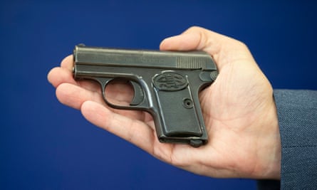 Detective Inspector Gary Winter holds a replica of the gun used in the killing of Alistair Wilson.