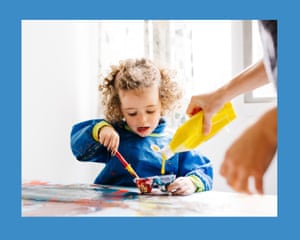 Drawing with brush little kid. Horizontal indoors shot