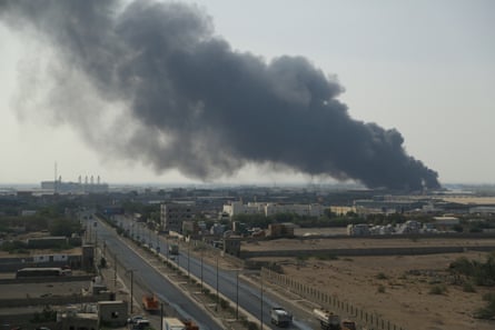 Smoke rises from a warehouse of the World Food Programme as fire engulfs it, in Hodeidah, 31 March