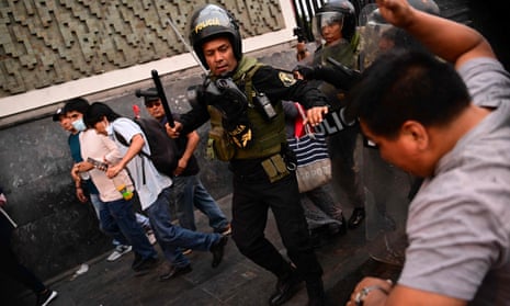 Supporters of former president Pedro Castillo clash with riot police during a protest in Lima
